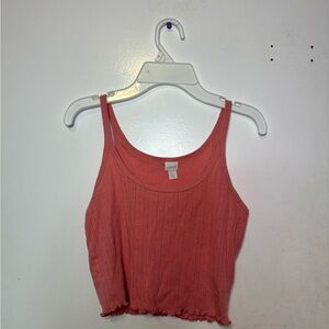 cropped tank top in a salmon color.